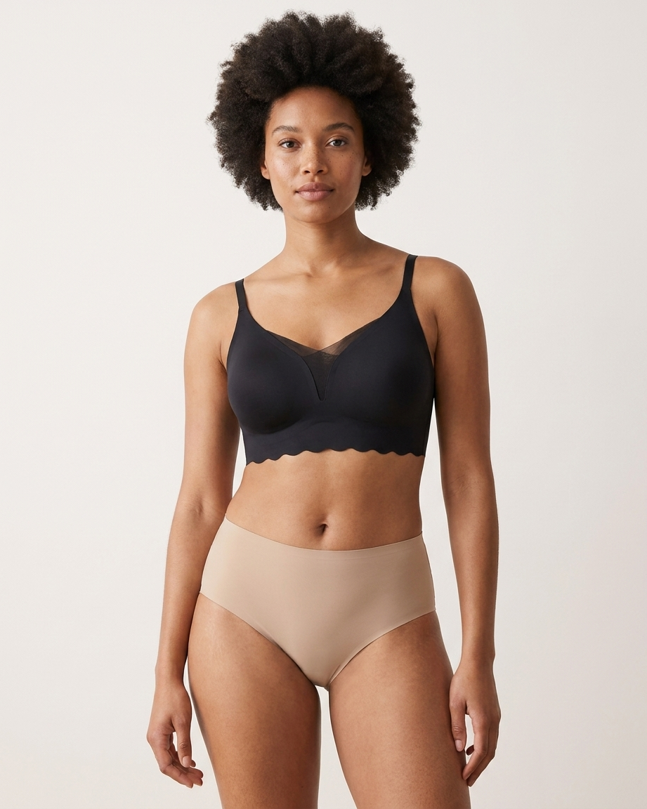 Woman wearing a black Scalloped Gel Bra against a plain background