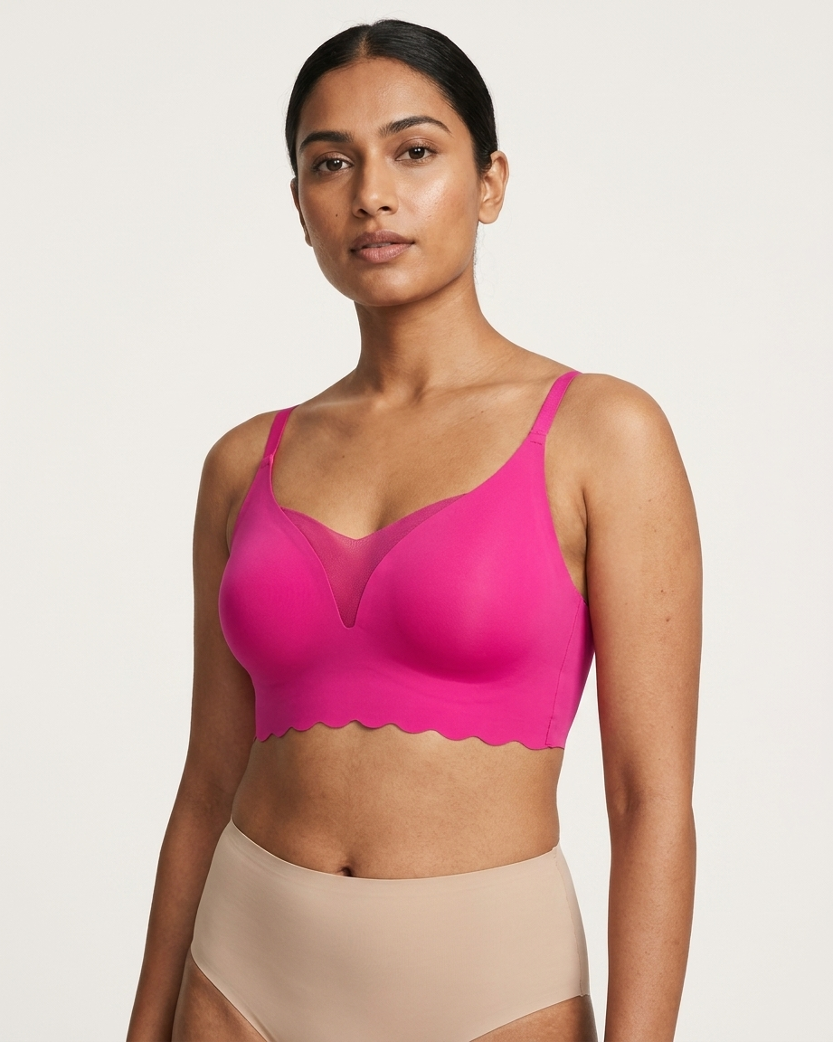 Woman wearing a pink Scalloped Gel Bra against a plain background
