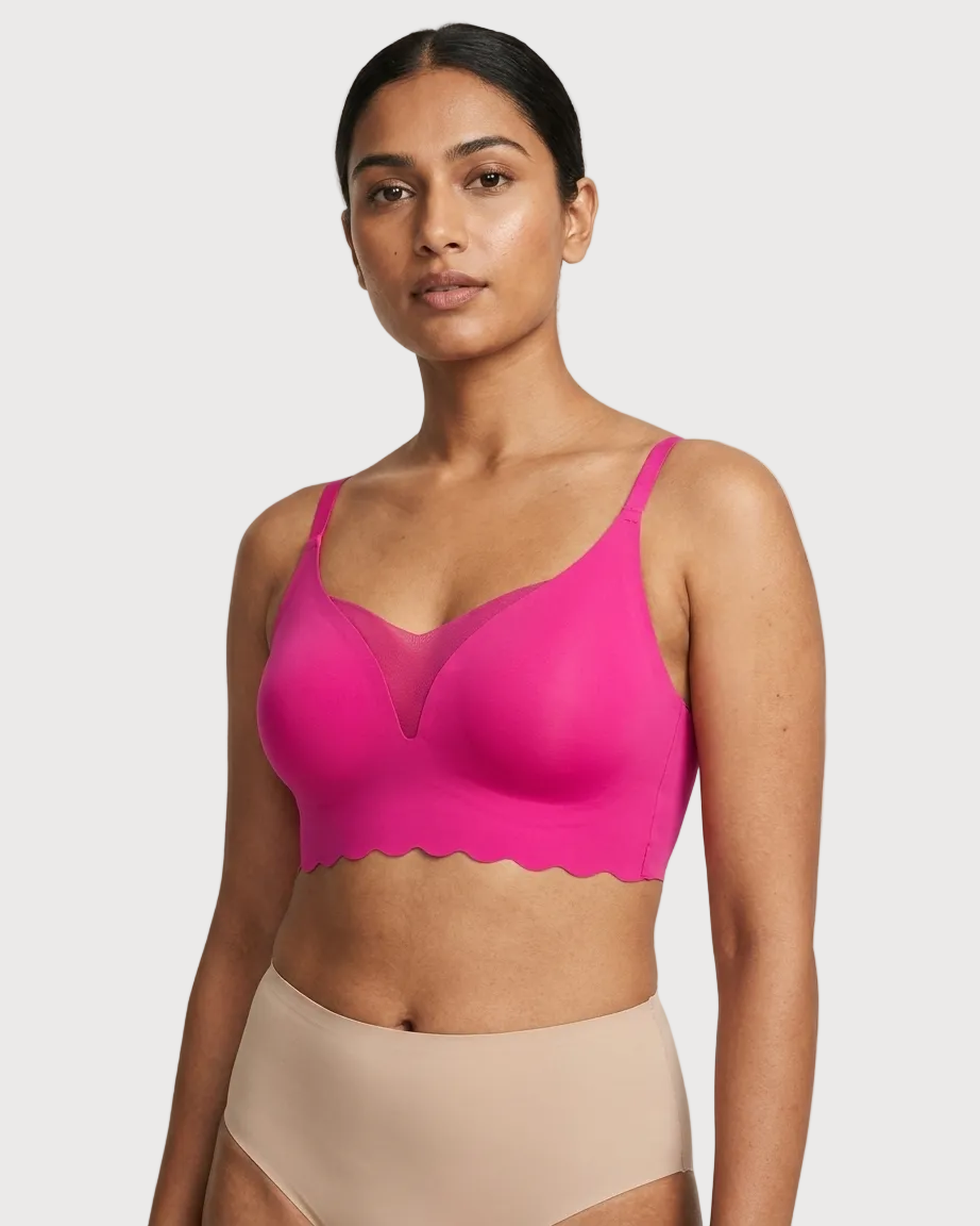 Woman wearing a pink Scalloped Gel Bra against a plain background