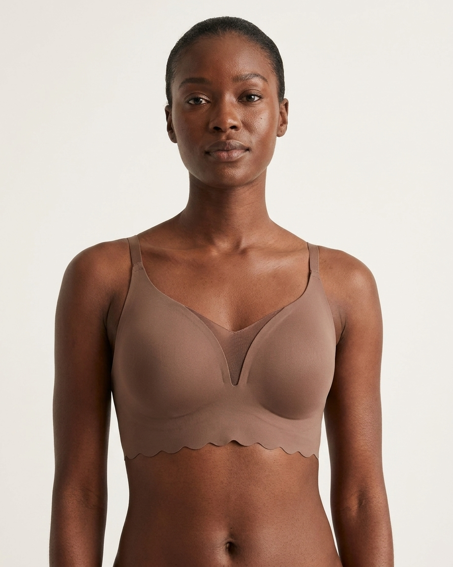 Woman wearing a brown Scalloped Gel Bra against a plain background