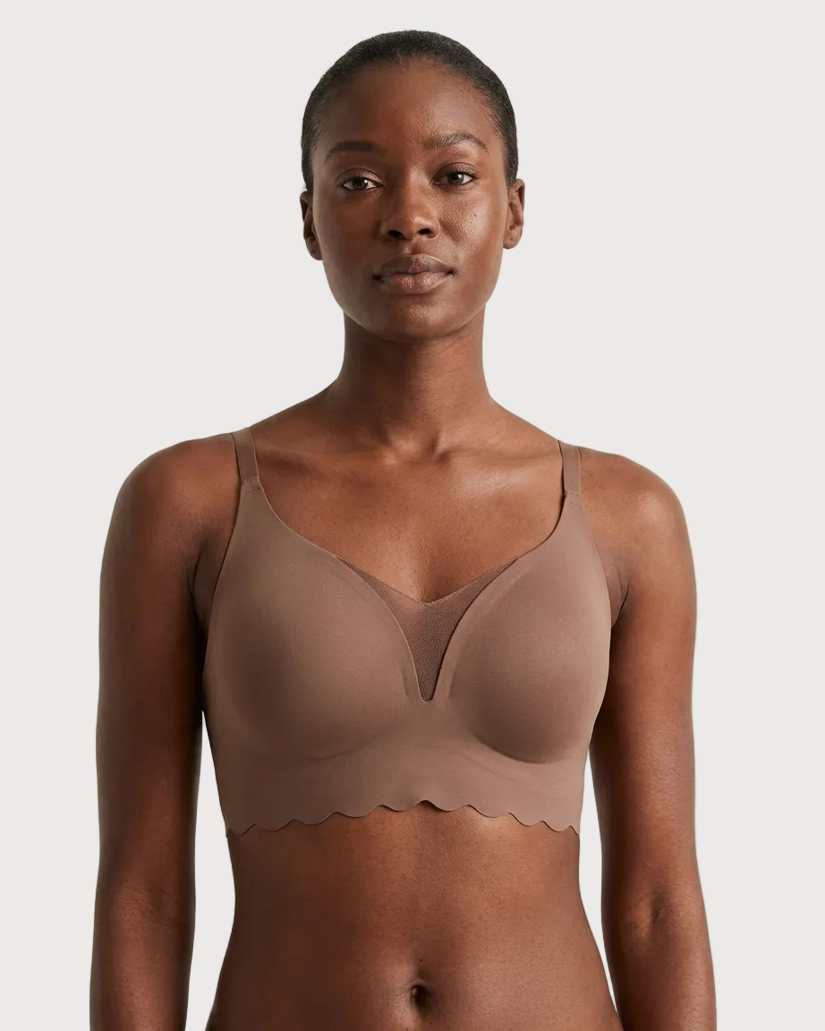 Woman wearing a brown Scalloped Gel Bra against a plain background
