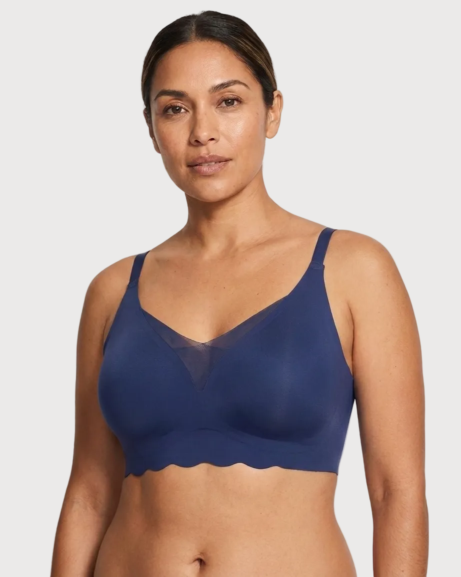 Woman wearing a navy Scalloped Gel Bra against a plain background