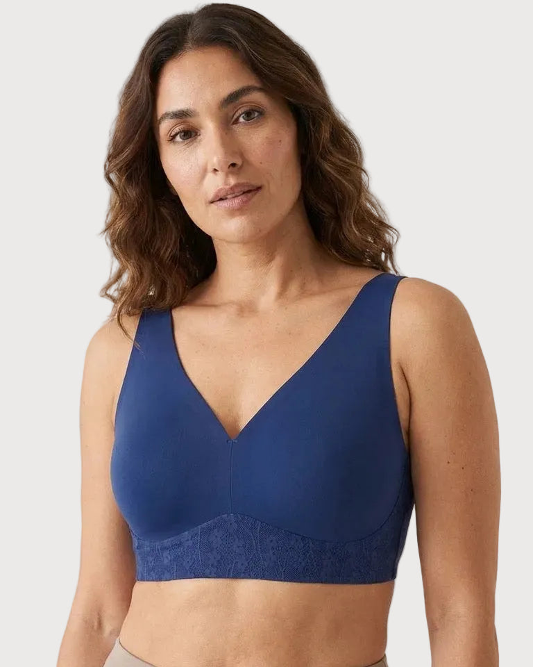 Woman wearing a blue Plunge Bra With Lace and Back Closure against a plain background
