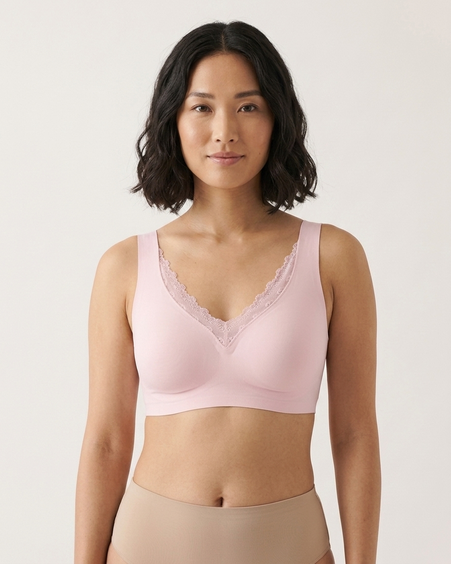 Woman wearing a pink Gel Bra with Lace Detail and Back Closure bra against a gray background
