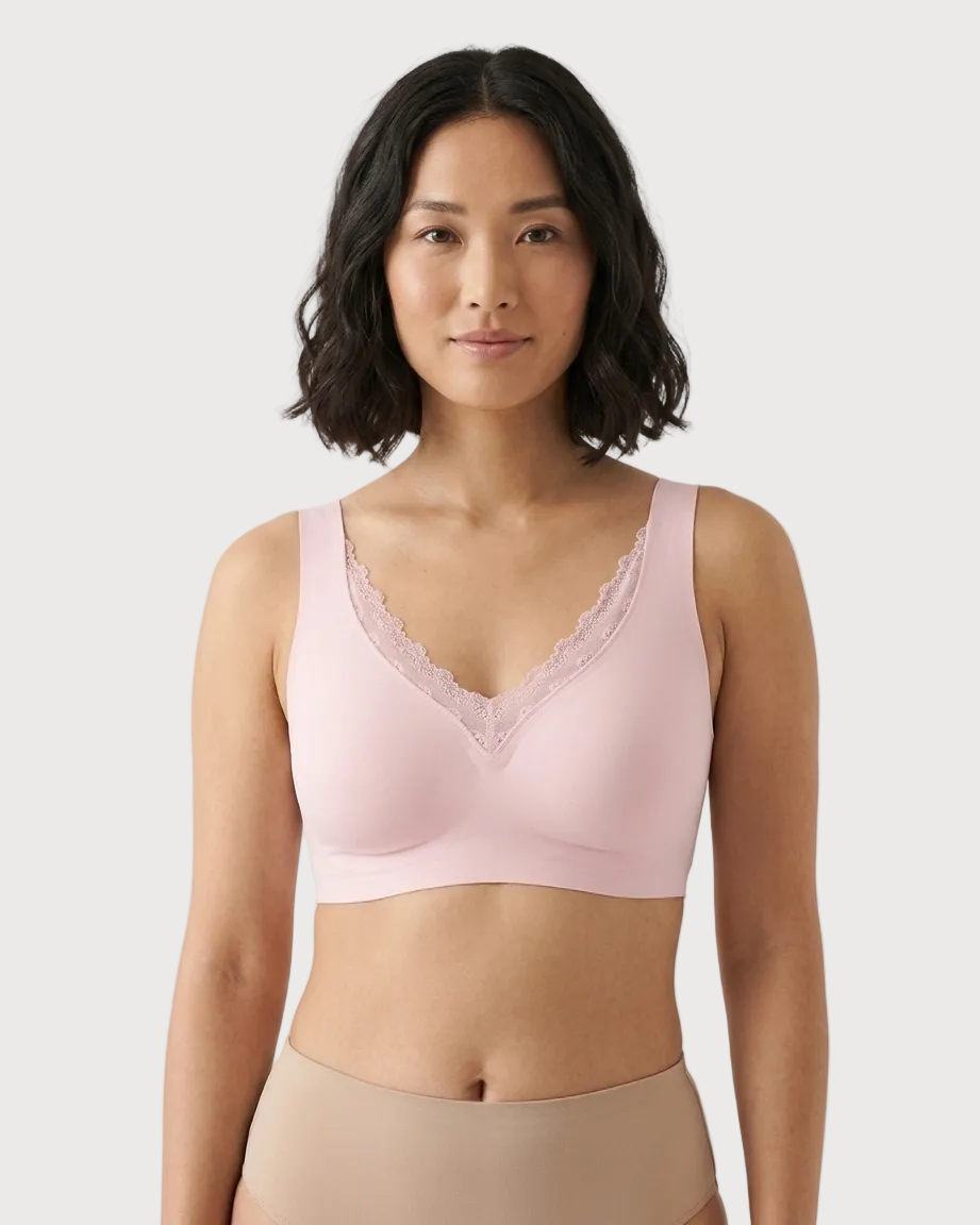 Woman wearing a pink Gel Bra with Lace Detail and Back Closure bra against a gray background
