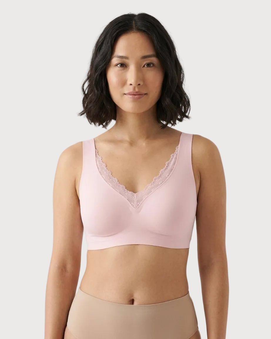 Woman wearing a pink Gel Bra with Lace Detail and Back Closure bra against a gray background
