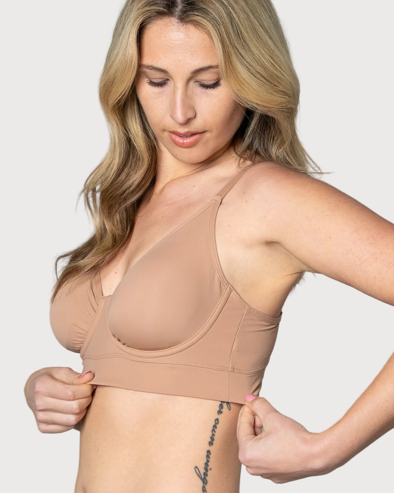 Woman wearing a beige Butterknit No Wire Underwire bra and underwear set against a gray background