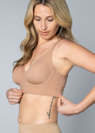 Woman wearing a beige Butterknit No Wire Underwire bra and underwear set against a gray background