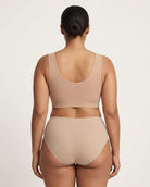 A model shown from the back wearing a beige Mesh Front Leisure Bra, against a plain light background.