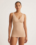 A model wearing a beige Adjustable Strap Butterknit Tank, photographed against a clean, light off-white studio background.