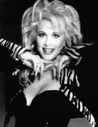 Black and white portrait of Rhonda Shear wearing a zebra-striped outfit with a dramatic pose.